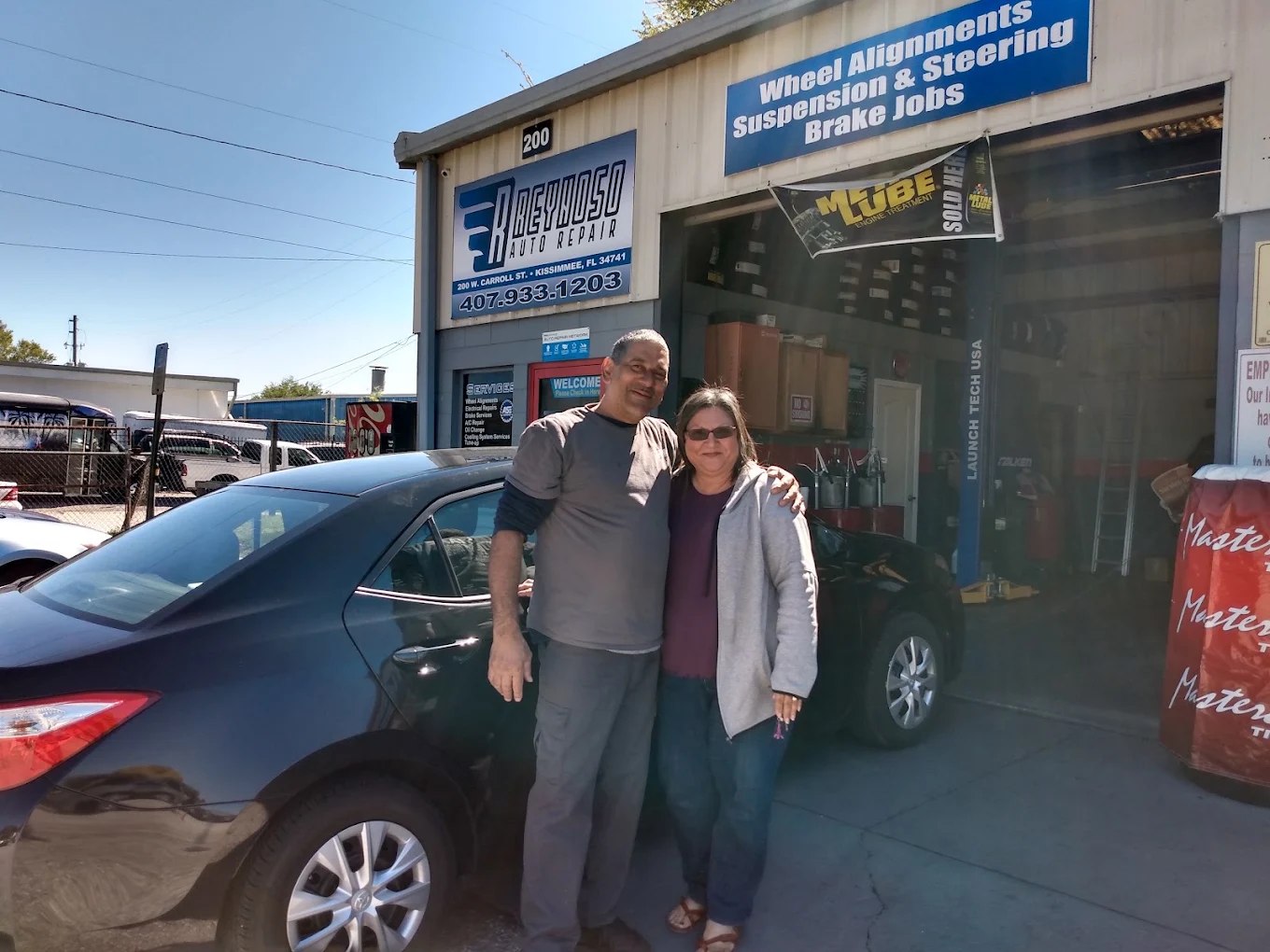 Reynoso Auto Repair team in front of the shop